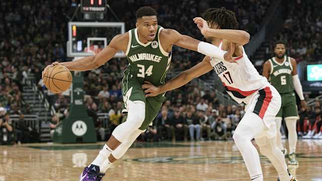 Milwaukee Bucks forward Giannis Antetokounmpo (34) drives for the basket against Portland Trail Blazers guard Shaedon Sharpe (17)